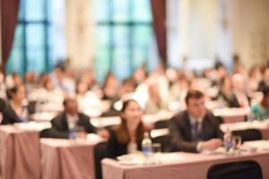 Abstract blurred people in big meeting or conference room for background. vintage tone photo