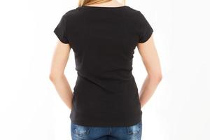 Rear view - Woman body in empty black Tshirt mock up close up isolation. photo