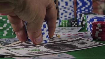 Gambling Tools Like Poker Cards Money Chips and Red Dices video