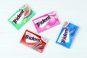 KHARKIV, UKRAINE - MARCH 15, 2021 Packs of Trident gums. Trident was introduced in 1964 as one of the first patented sugarless gums photo