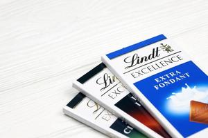 KHARKIV, UKRAINE - DECEMBER 18, 2020 Lindt Chocolate on white background. Lindt and Spruengli AG is a Swiss chocolatier and confectionery company known for their chocolate bars photo