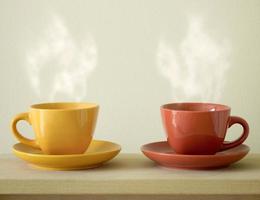steaming coffee cup on table photo