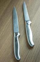 kitchen knife on dark wood background photo