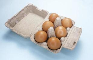 Fresh Chicken brown eggs on table photo