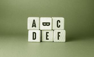 Alphabet English Text Written on Wooden Cubes photo