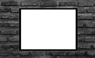 Mockup white picture frame on black brick wall background with clipping path photo