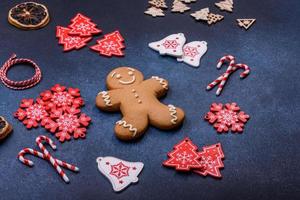 Christmas homemade gingerbread cookies on a dark concrete table photo