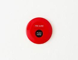 red fire alarm on wall photo