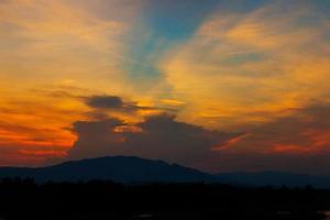 beautiful sunset with mountain photo