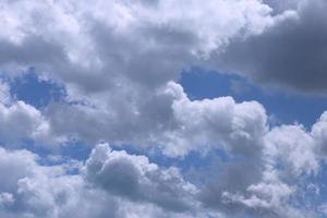 Heavenly cloudy landscape, white and gray clouds against the blue sky. Background. photo