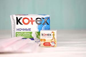 KHARKIV, UKRAINE - DECEMBER 16, 2021 Kotex production with logo. Kotex is a brand of feminine hygiene products, includes maxi, thin and ultra thin pads. photo