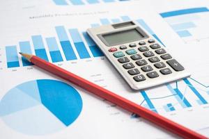 Calculator on chart and graph paper. Finance development, Banking Account, Statistics. photo