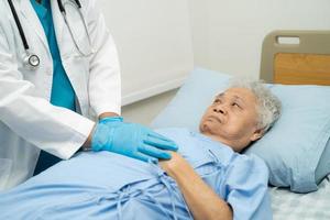 Holding hands Asian senior or elderly old lady woman patient with love, care, encourage and empathy at nursing hospital ward, healthy strong medical concept photo