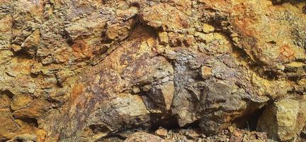 Seen very good rock cliff reliefs. This rock cliff is located near a reservoir in Kulon Progo, Yogyakarta. photo