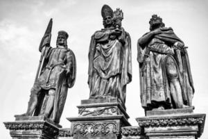 Close up view on statues on Charles bridge in Prague, Czech republic photo