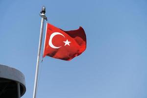 Turkish flag in blue sky background photo