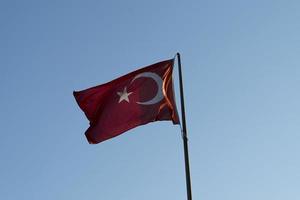 Turkish flag in blue sky background photo