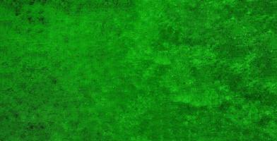 Ancient bright green colored textured concrete wall grunge background photo