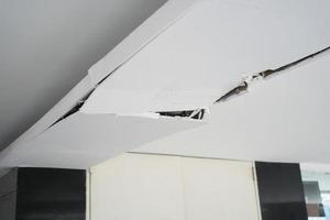 Ceiling panels broken and damage from car crash , photo