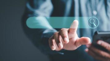 search technology Search Engine Optimization, Man's Hand Pointing to Internet Search Icon, Using Search Console on Your Website, Connecting and Searching Big Data Worldwide via Keywords. photo