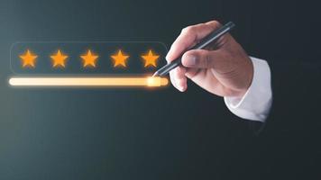 satisfaction rating customer service The best business scoring experience positive feedback Great Star Achievement Assessment business man pointing pen to five star review rating slider button photo