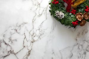 Directly above shot of Christmas decorations on marble table. photo