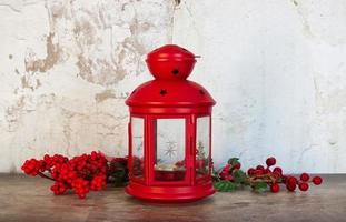 Red Christmas Lamp isolated on wall background. Christmas decorations. photo