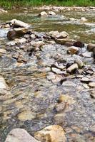 ford at river in caucasus mountains photo