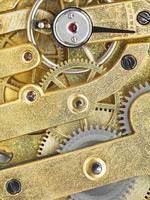 background from brass clockwork of vintage watch photo