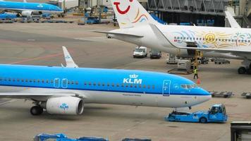 AMSTERDAM, THE NETHERLANDS JULY 29, 2017 - KLM Boeing 737 PH BXY towing before departure. Shiphol Airport, Amsterdam, Holland video