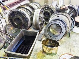 gears of disassembled engine in workshop photo