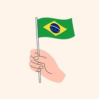 caricatura, mano, tenencia, brasileño, bandera, icono, el, bandera, de, brasil, concepto, illustration. vector aislado de diseño plano.
