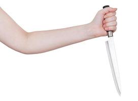 mano femenina con cuchillo de cocina grande foto