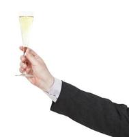 toast with champagne glass in businessman hand photo