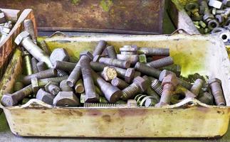 many old bolts on workbench in turnery photo