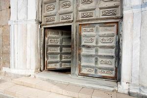ancient doors of medieval cathedral photo