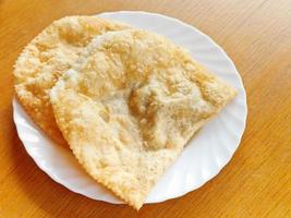 cheburek pie on white plate photo