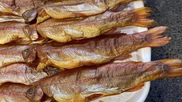 Natural background with smoked trout close-up photo