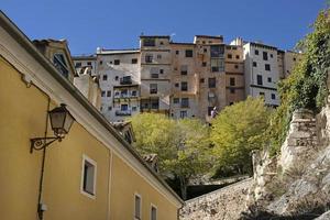 Beautiful buildings in Cuenca, Spain, during autumn season photo