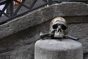 Bronze skull in front of Purgatorio Ad Arco In Naples photo