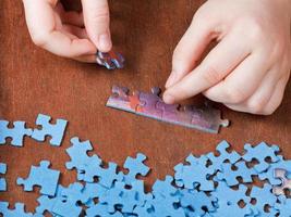 fitting of jigsaw puzzles photo