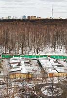 spring skyline with urban park and vehicle sheds photo