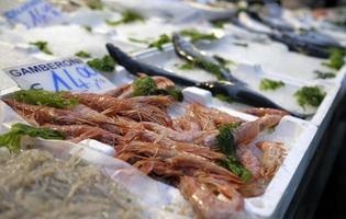 Goods on display at a fish market in Naples, Italy photo
