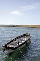 Boat in the calm bay of Chania, Crete photo