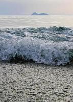 Waves coming in at Matala beach, Crete photo