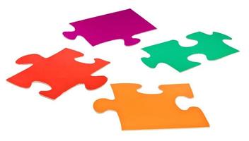 four cardboard flat jigsaw puzzle pieces photo