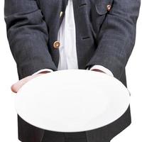 front view of businessman holds empty white plate photo