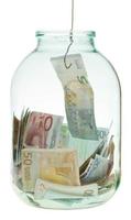 catching saving euro money from glass jar photo