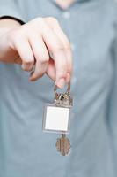 blank key fob in hand close up photo