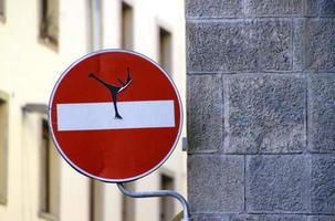 Figure skater on a road sign in Florence, Italy photo